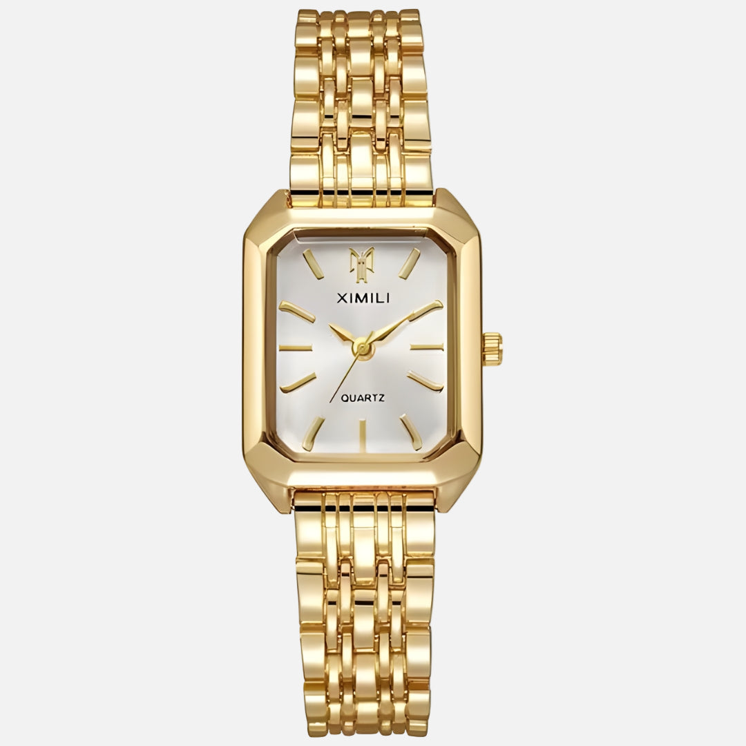 Gold wristwatch with a white face on a white background